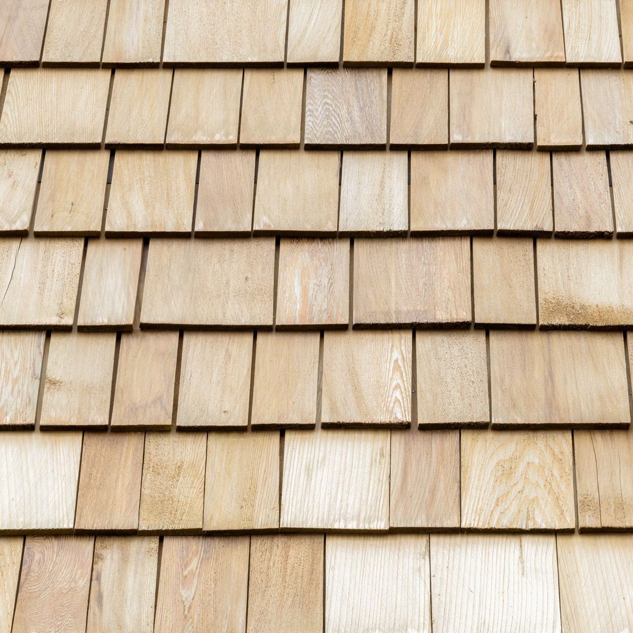 A close up of a wood shake roof.