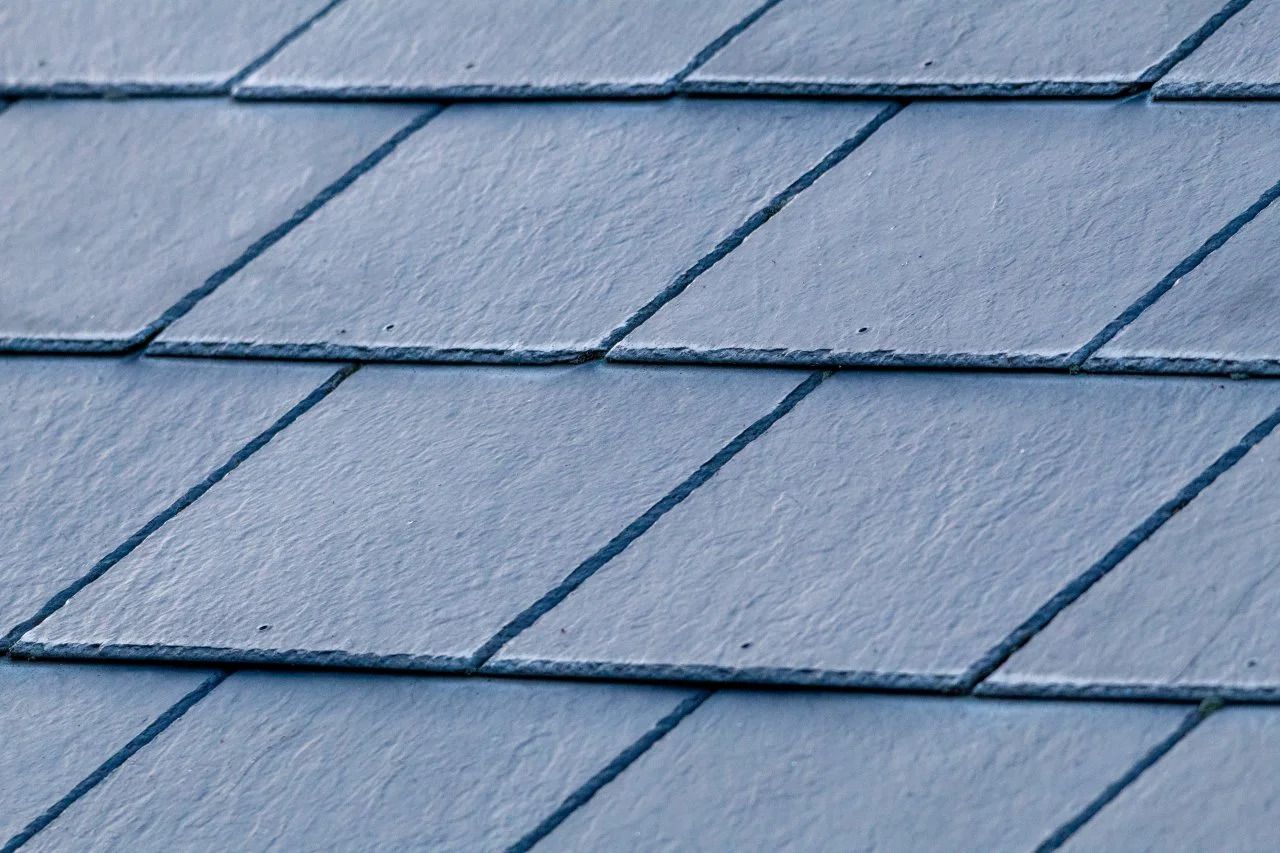 A close up of a synthetic slate roof