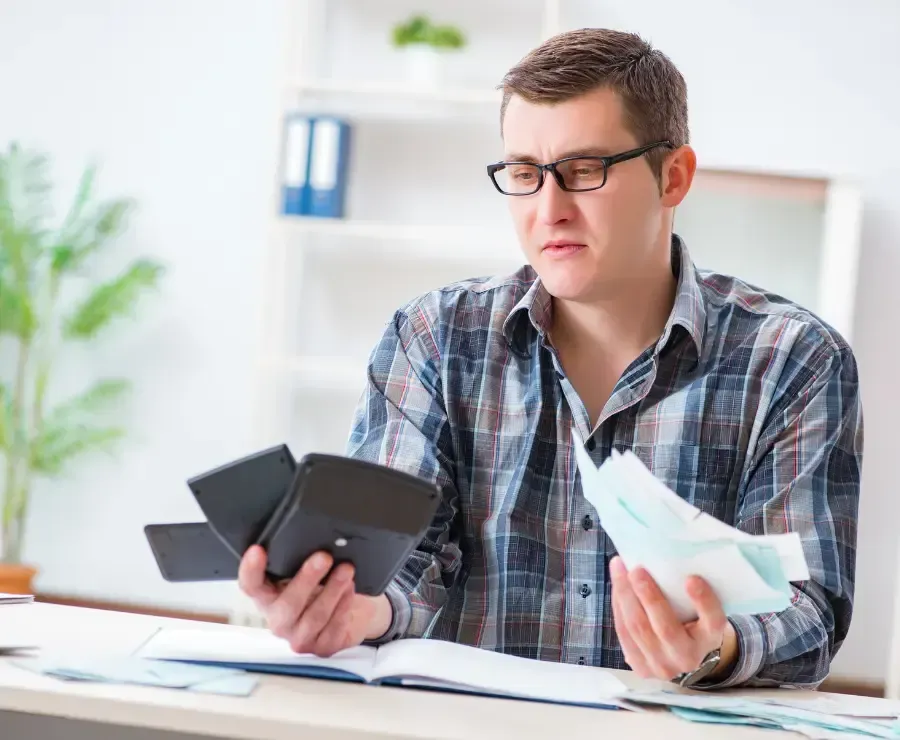 Man Frustrated with Tax Bills