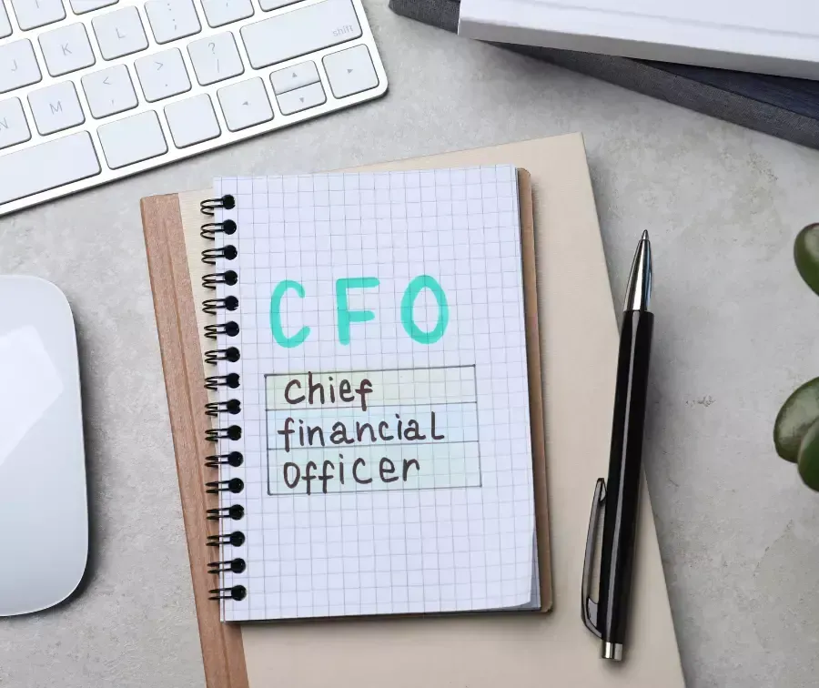 A notebook with the words cfo chief financial officer written on it.