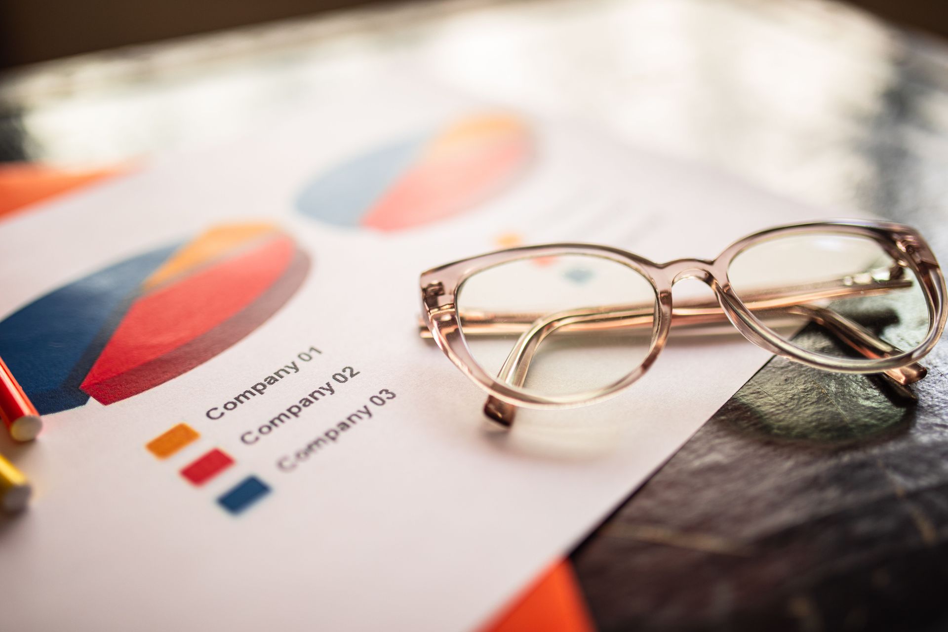 Eyeglasses on a printed color chart and document on a desk