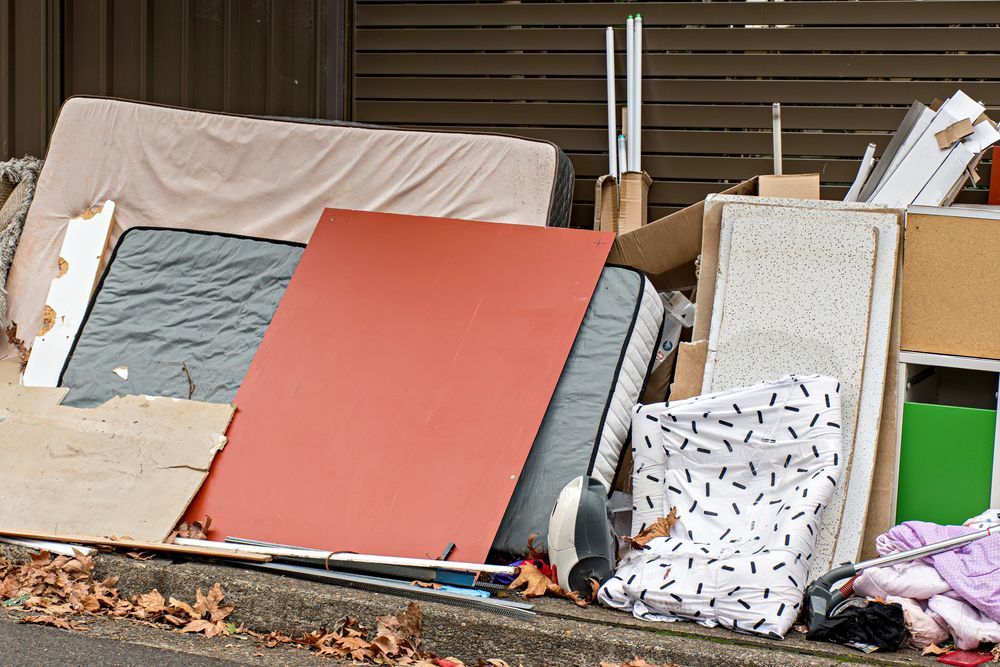 A Pile Of Junk Is Sitting On The Side Of The Road — Green Solutions Qld in Mulara, QLD