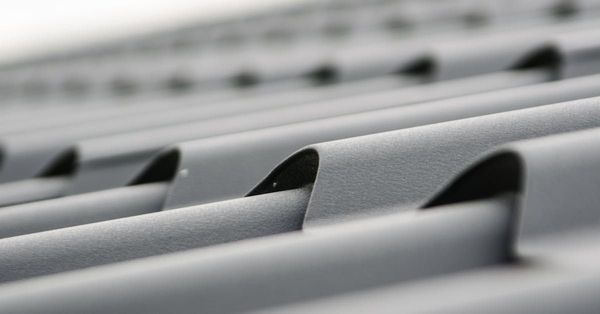 Metal roofing material on the about us page for Total Shield Roofing