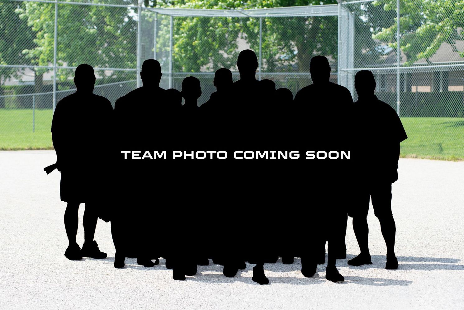 Silhouetted team on a baseball field, 