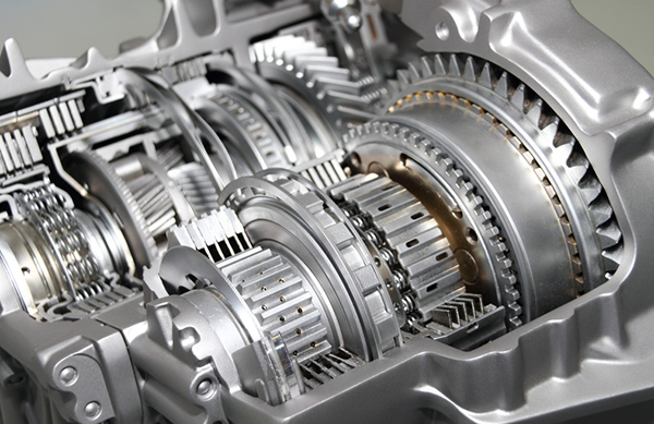 A close up of a gearbox with a lot of gears.
