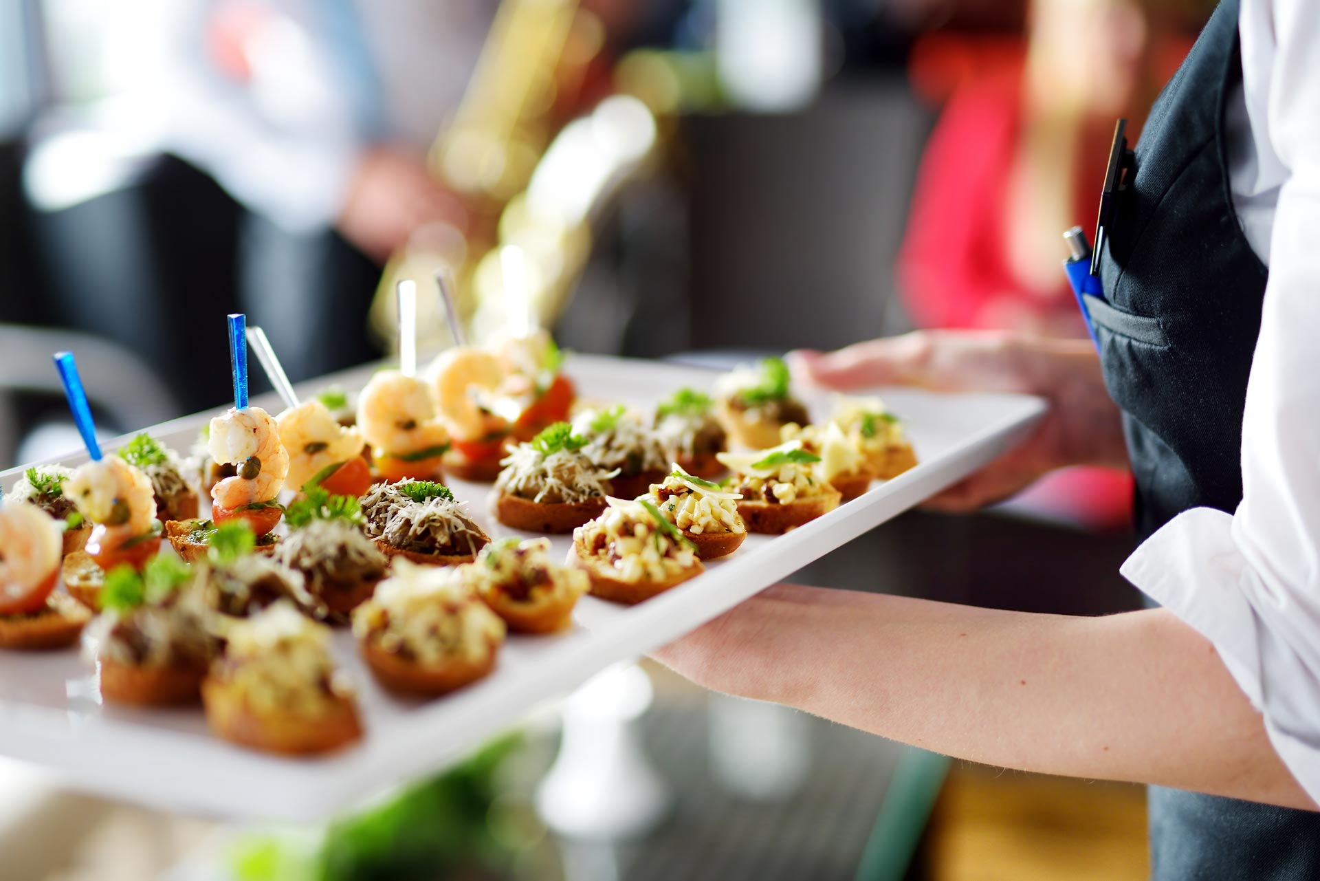 waiter-carrying-plates-with-meat-dish