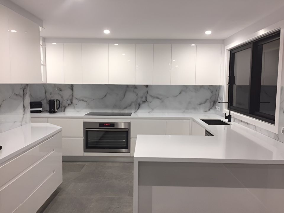 A Kitchen With White Cabinets and Marble Counter Tops — DecoGlaze in Minchinbury, NSW