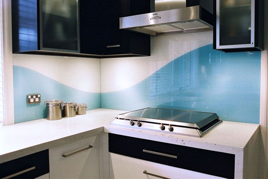A Kitchen With a Stove Top Oven and a Stainless Steel Hood — DecoGlaze in Windsor, NSW