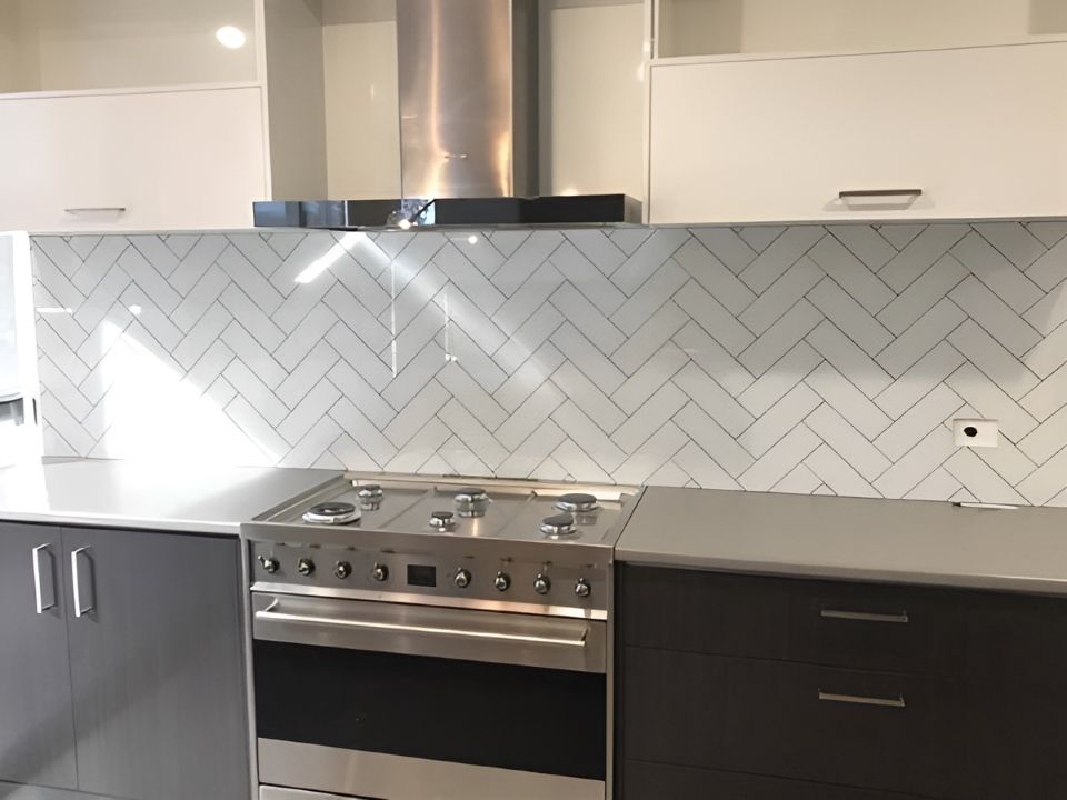 A Kitchen With a Stove Top Oven and a Hood — DecoGlaze in Minchinbury, NSW