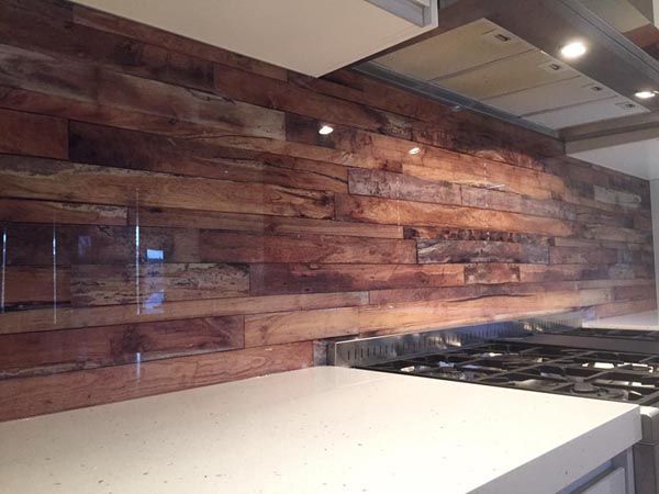 A Kitchen With a Wooden Wall and a Stove Top Oven — DecoGlaze in Camden, NSW