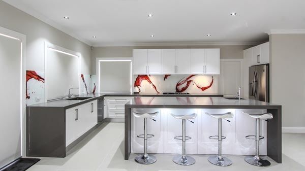 A Kitchen With White Cabinets and Stools and a Large Island — DecoGlaze in Camden, NSW