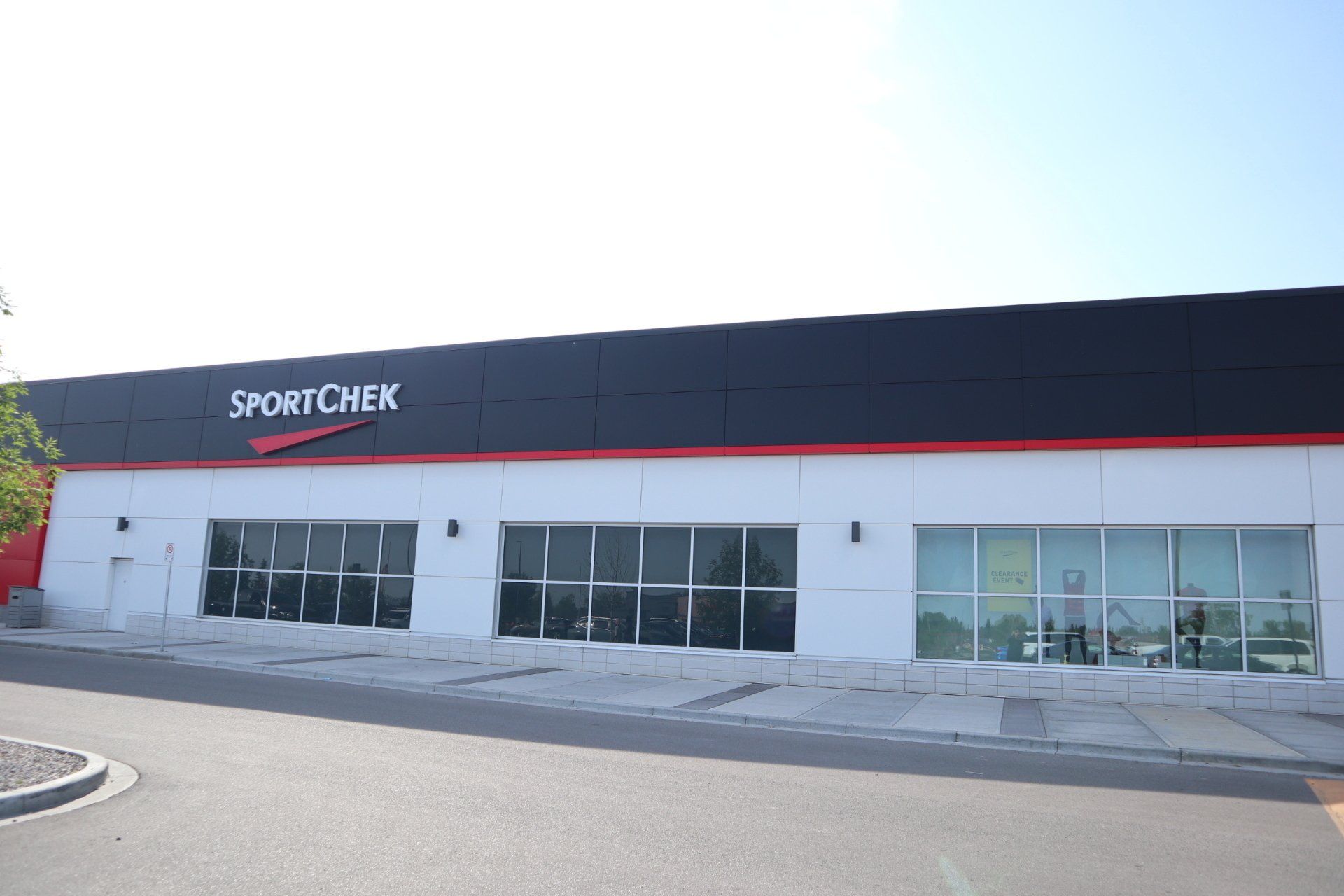 a black and white building with the word sportchek on it
