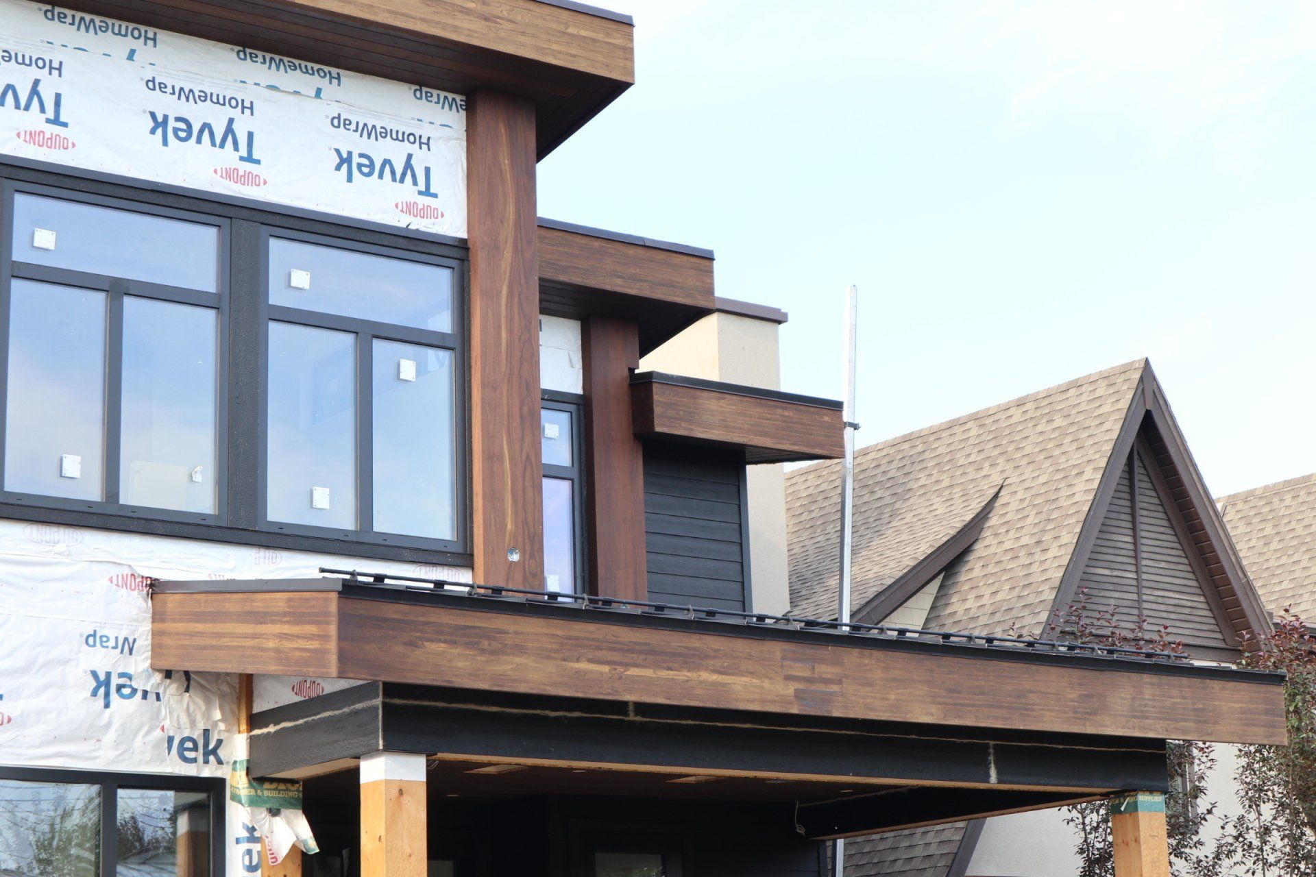 a building under construction with tyvek homewrap on it