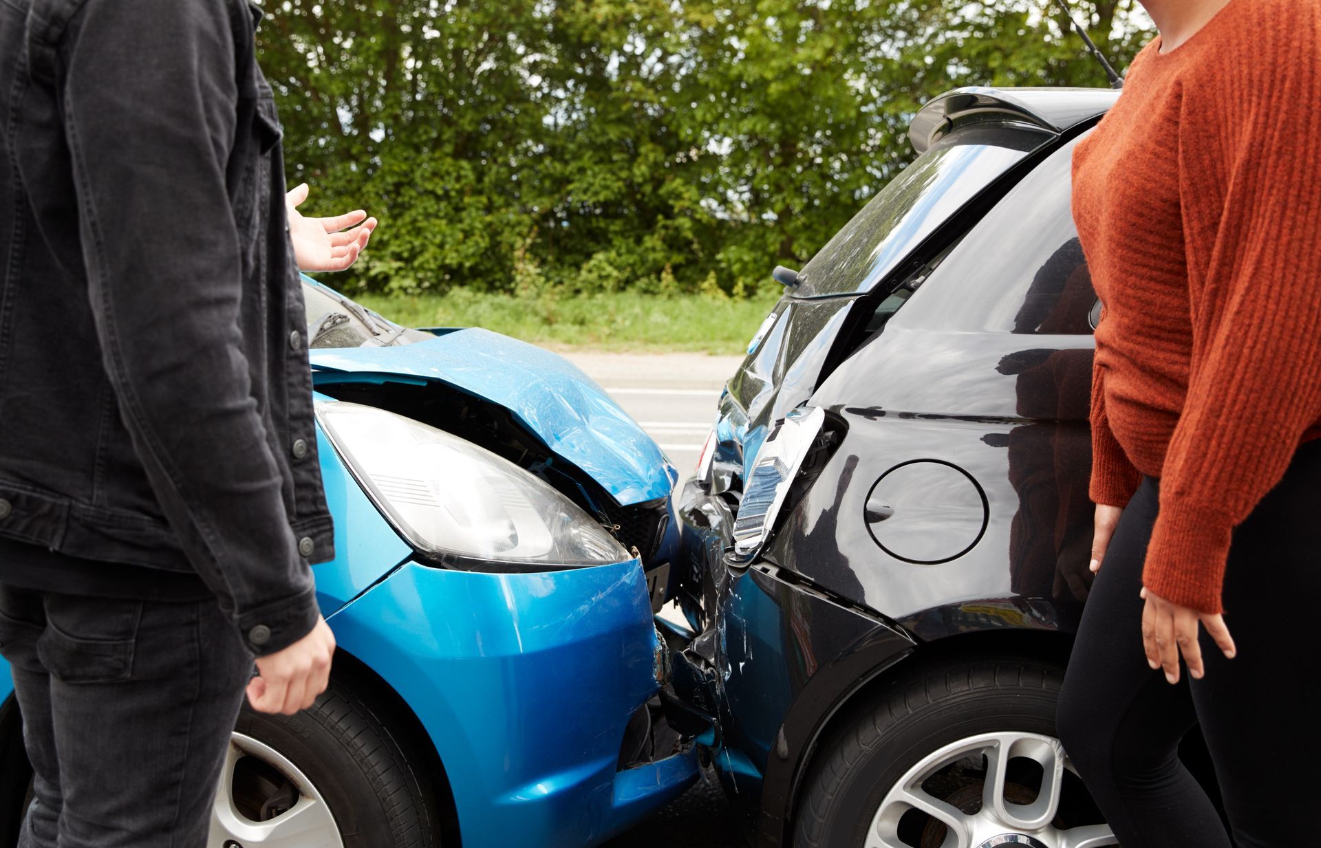 Two cars damaged in a head-on collision.