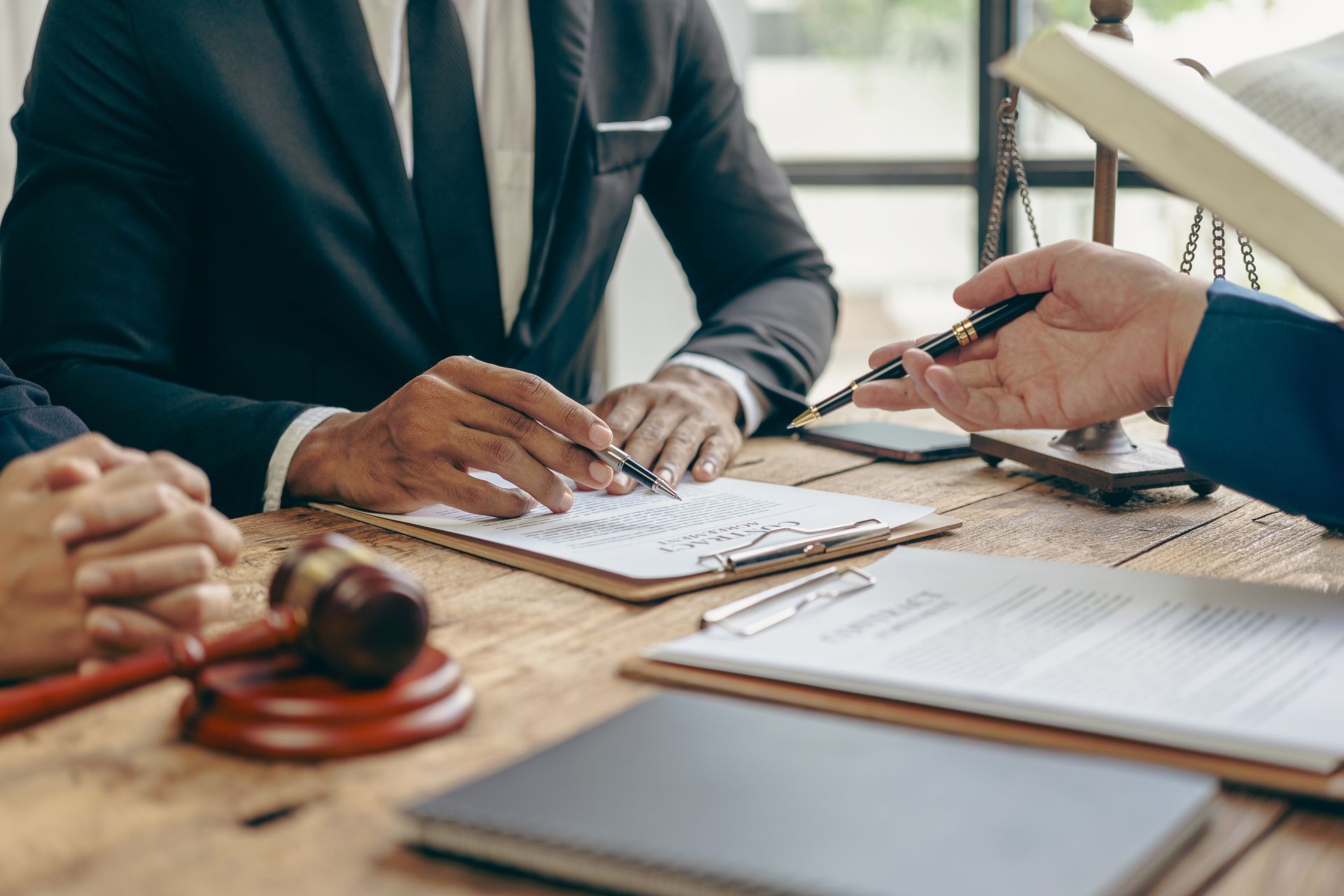 Lawyers reviewing documents at a table. 