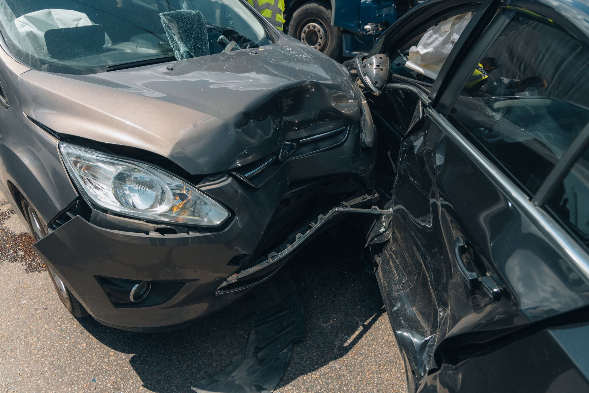 Two cars severely damaged in a head-on collision.