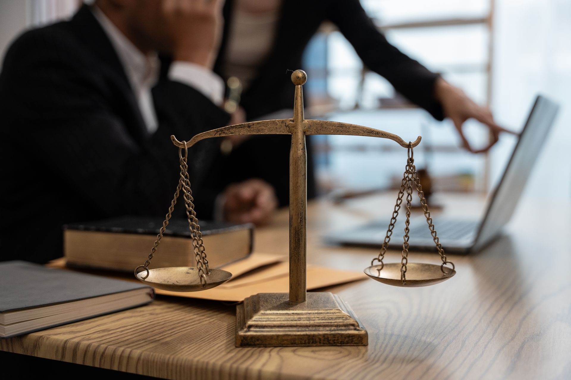 Scales of justice in foreground.