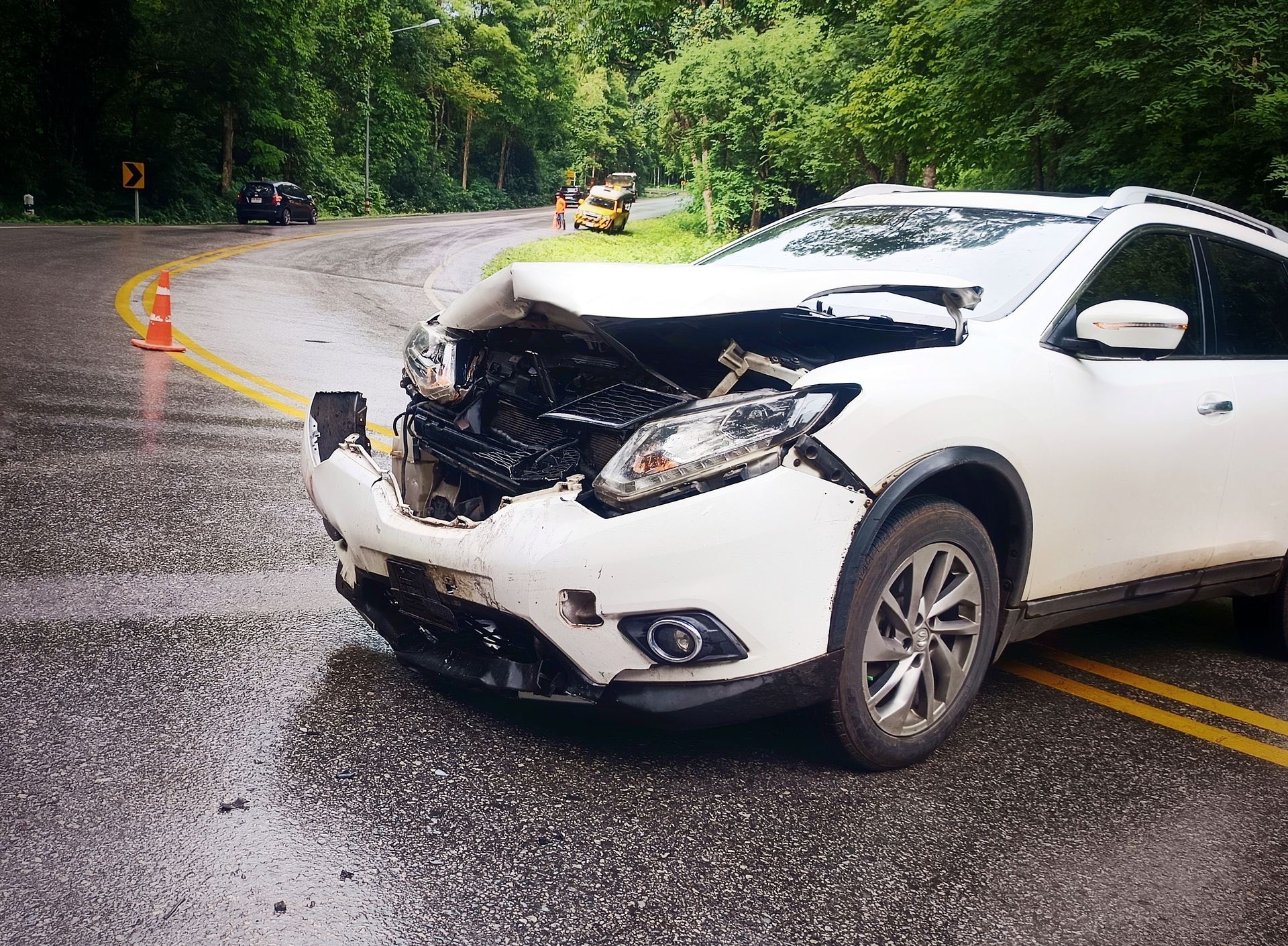 White car with front-end damage.