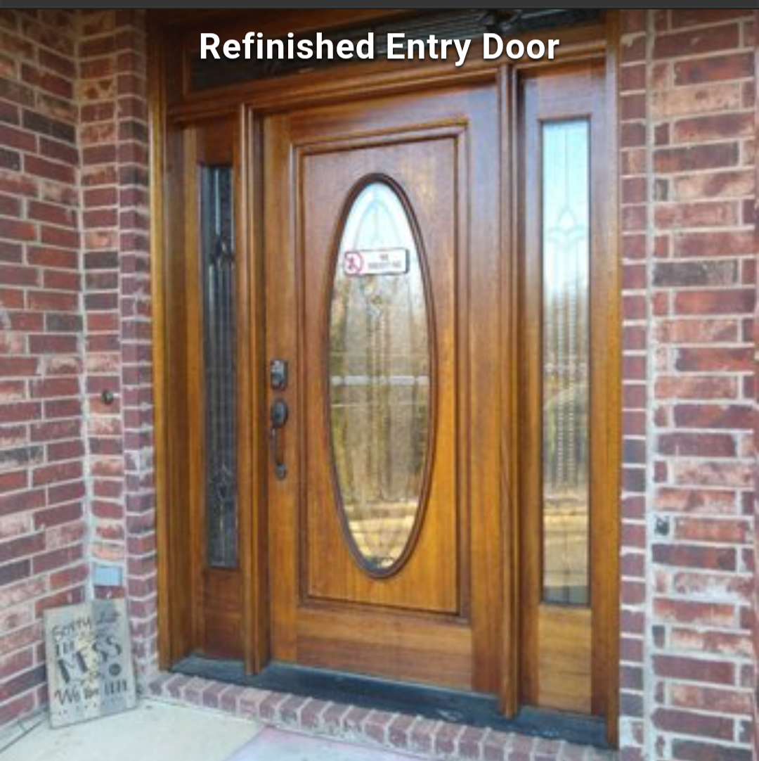 Refinished wooden front door with oval glass inset, framed by brick exterior walls and sidelights