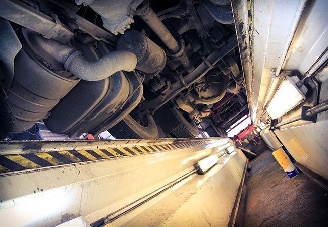 Crutcher Brothers Parts & Equipment Inc repairing the under carriage of a semi