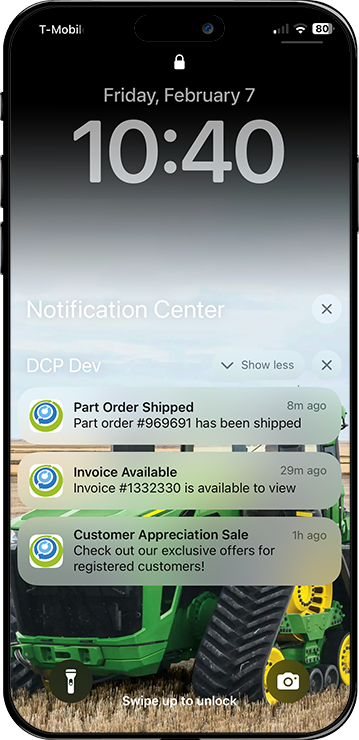 A cell phone with a picture of a john deere tractor on the lock screen and push notifications.