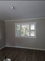 There is a large window in the middle of the room.