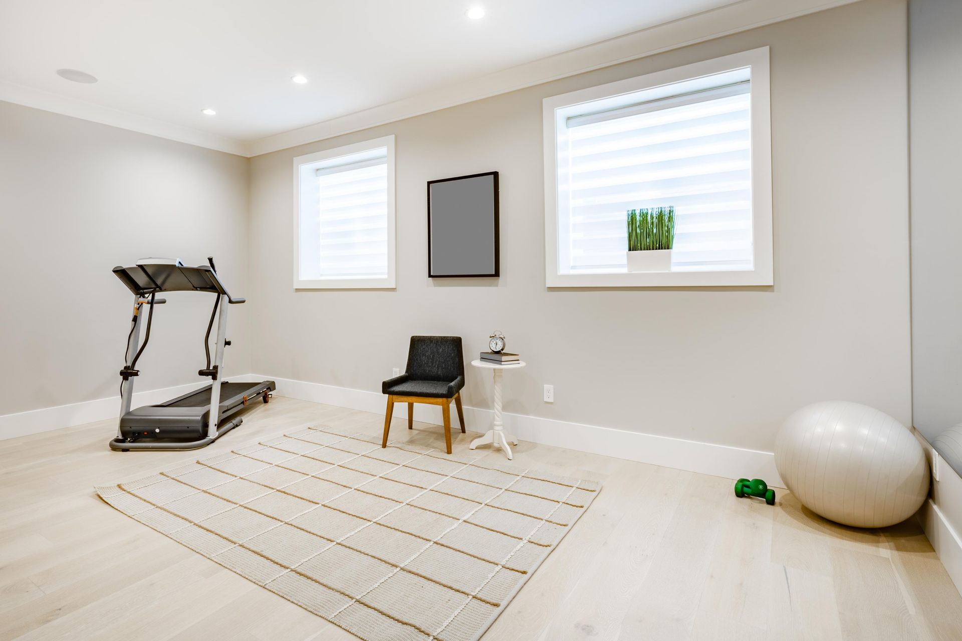 There is a treadmill in the middle of the room.
