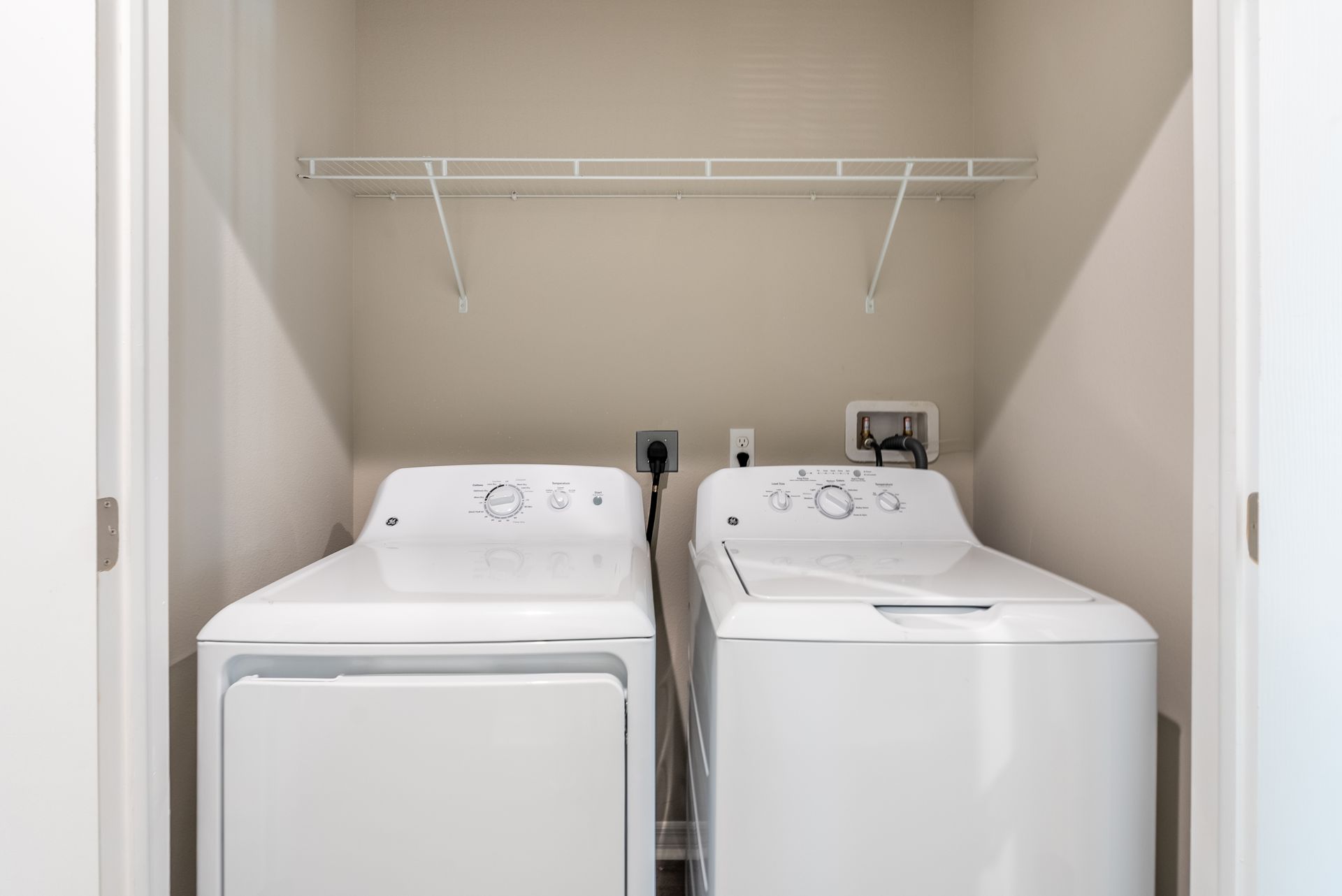 a laundry room with a washer and dryer in it