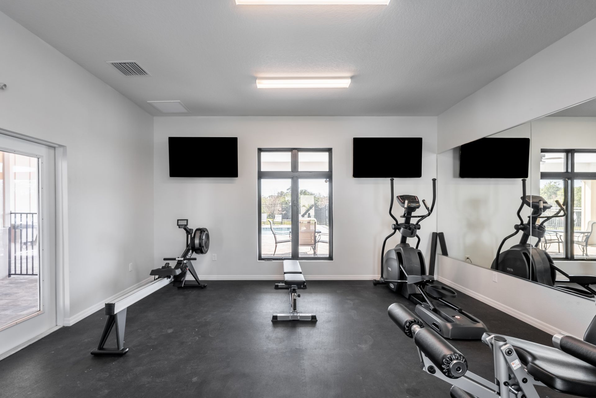 Gym with elliptical at Whitney Place Townhomes