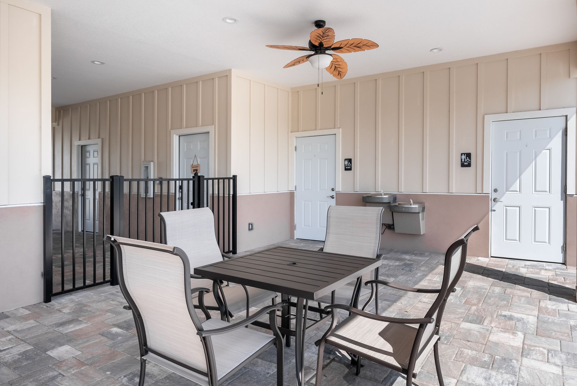 table and chairs and a ceiling fan 
