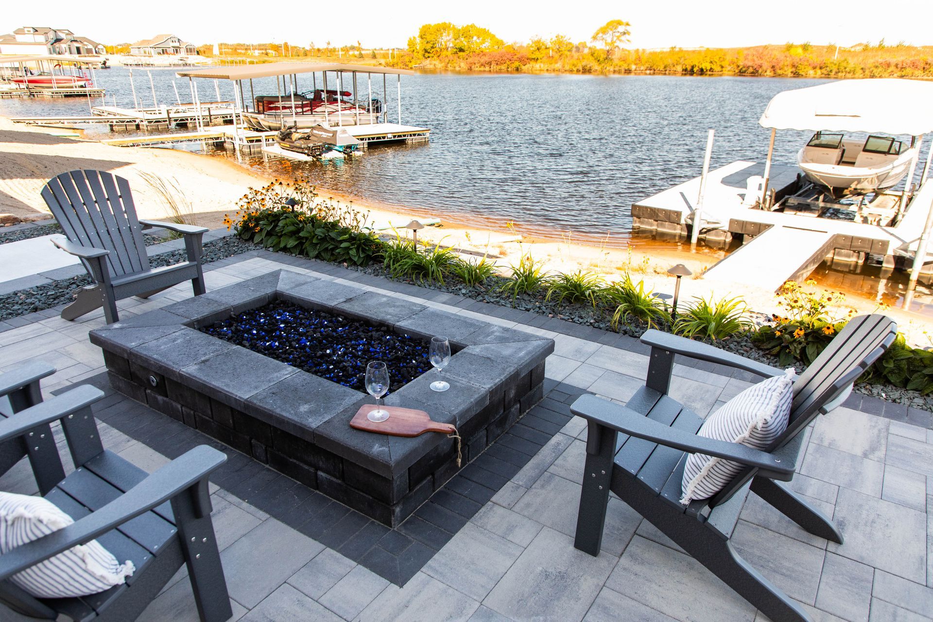 There is a fire pit in the middle of the patio.