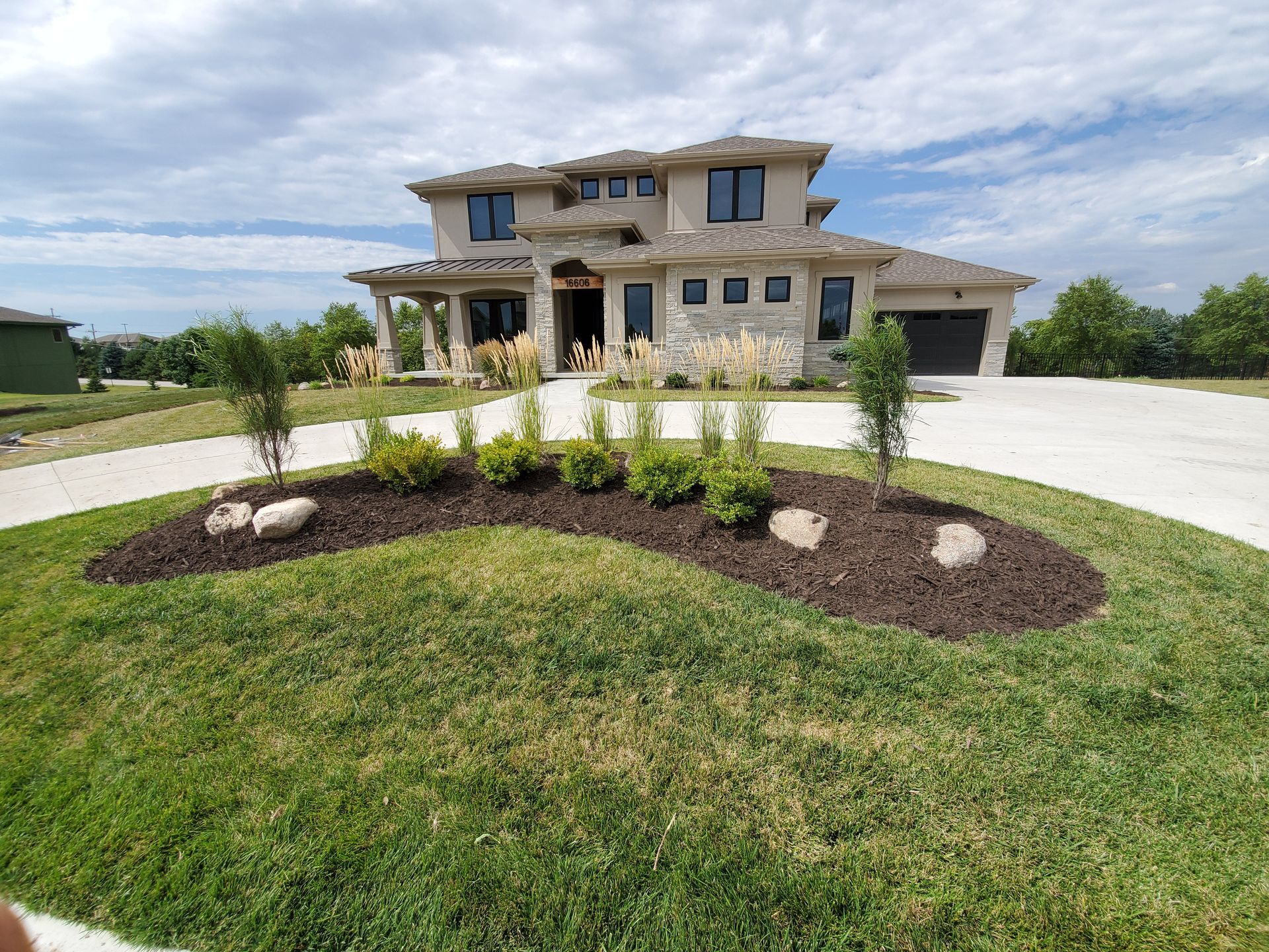 A large house with a driveway leading to it