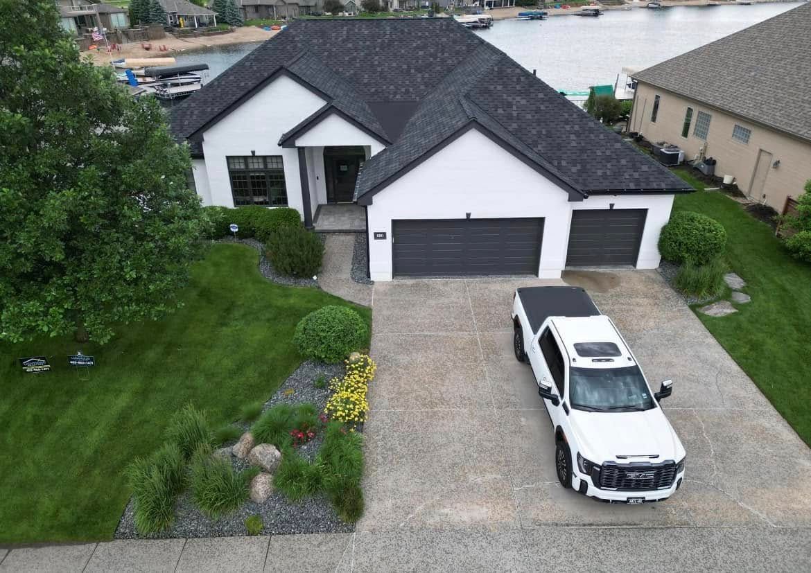 Local landscaping company Omaha NE service truck parked at residential property – Garret’s Lawn Services