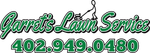 The logo for garrett 's lawn service shows a person holding a lawn mower.