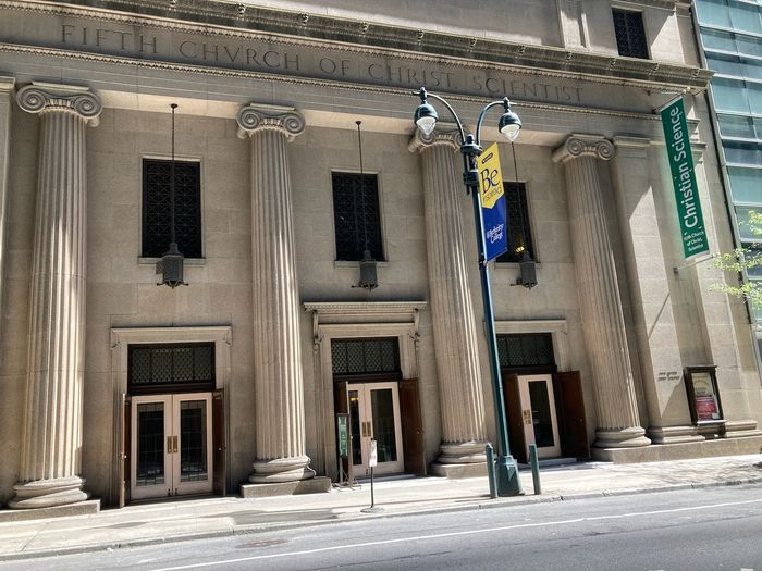 A large building with columns and a sign that says ohio video science