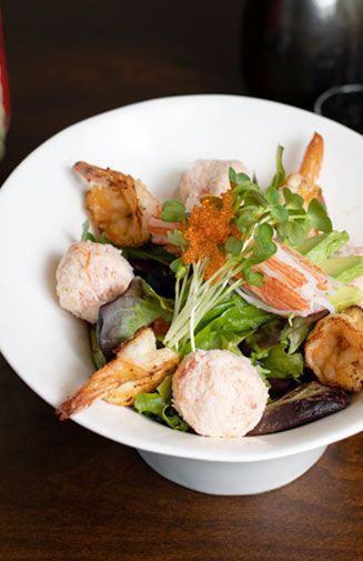 A close up of a bowl of food on a table.