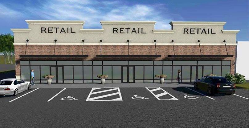 Strip mall storefronts labeled “RETAIL” with a few parked cars in front and empty accessible spaces.