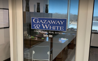 Gazaway & White commercial real estate sign on a glass office door, Suite 205