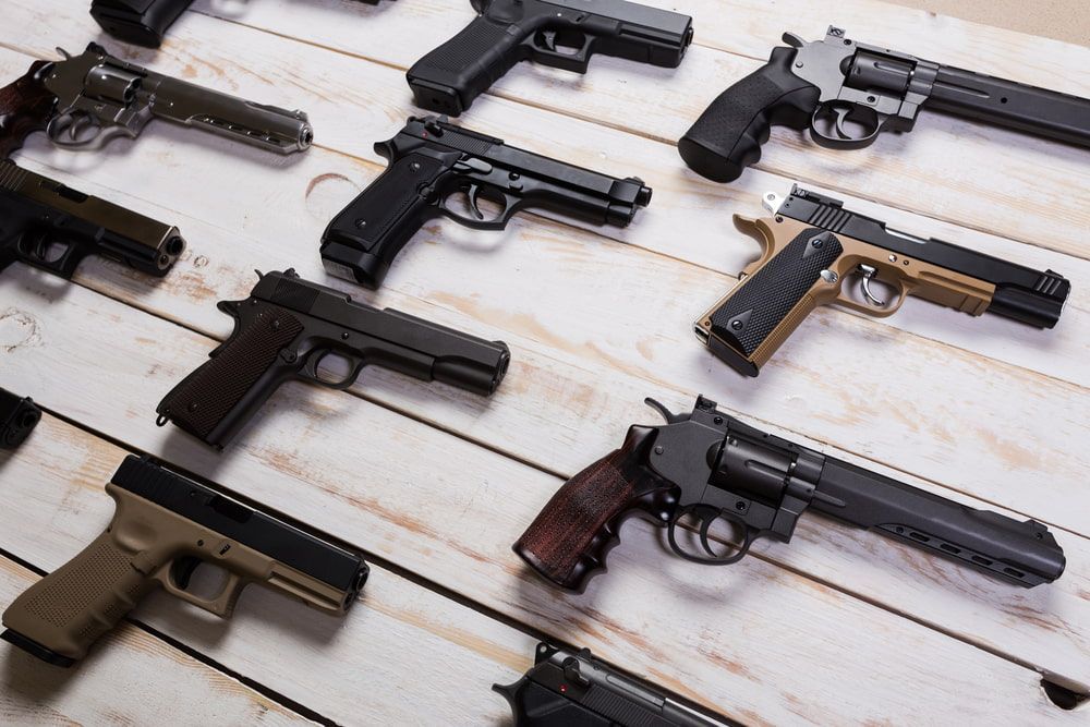 A Collection of Various Handguns and Revolvers Displayed — Mackay Shooters Supplies in Longreach, QLD