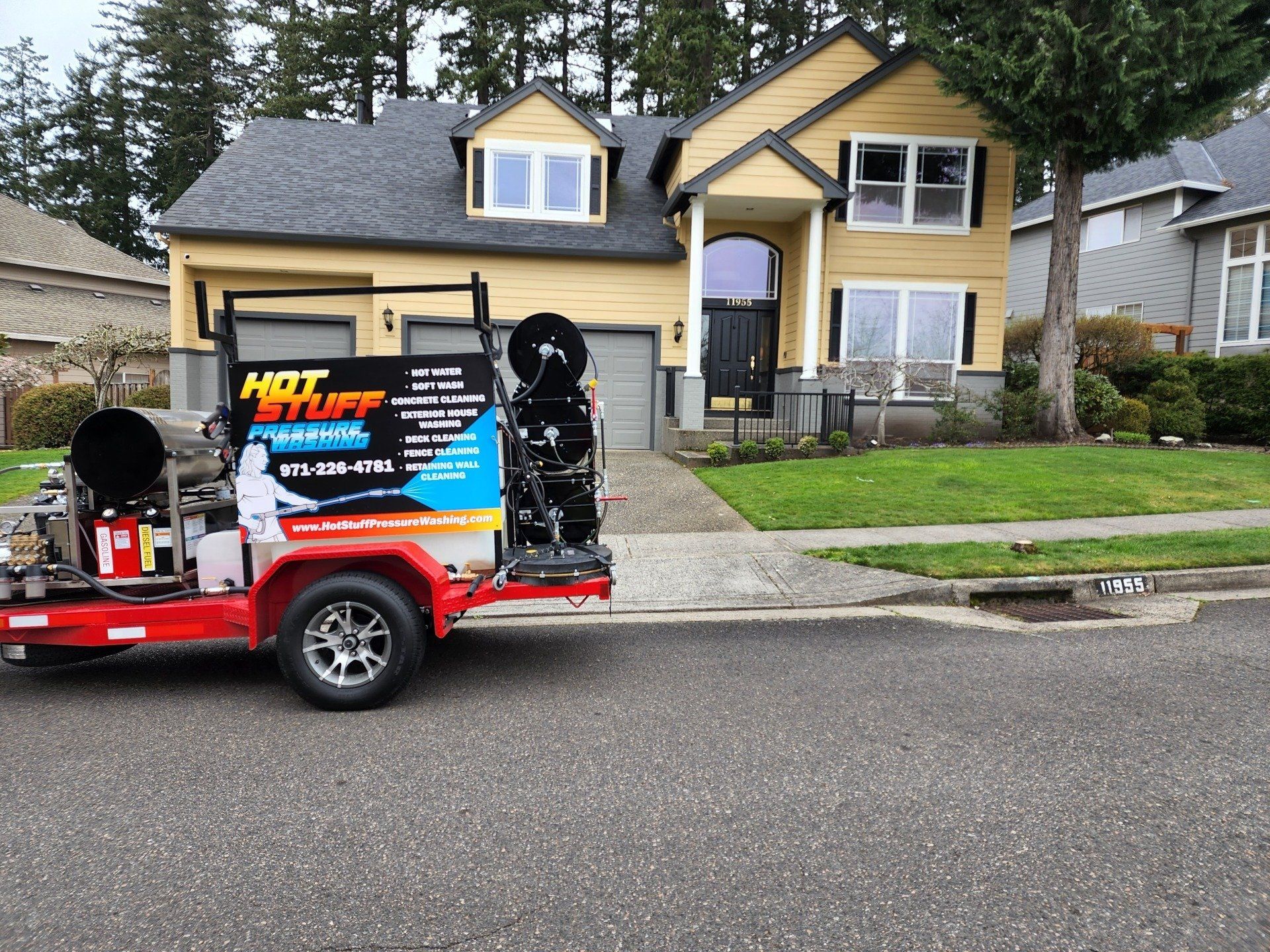 High-pressure hot water cleaning a concrete driveway, removing dirt and grime in Tigard Oregon