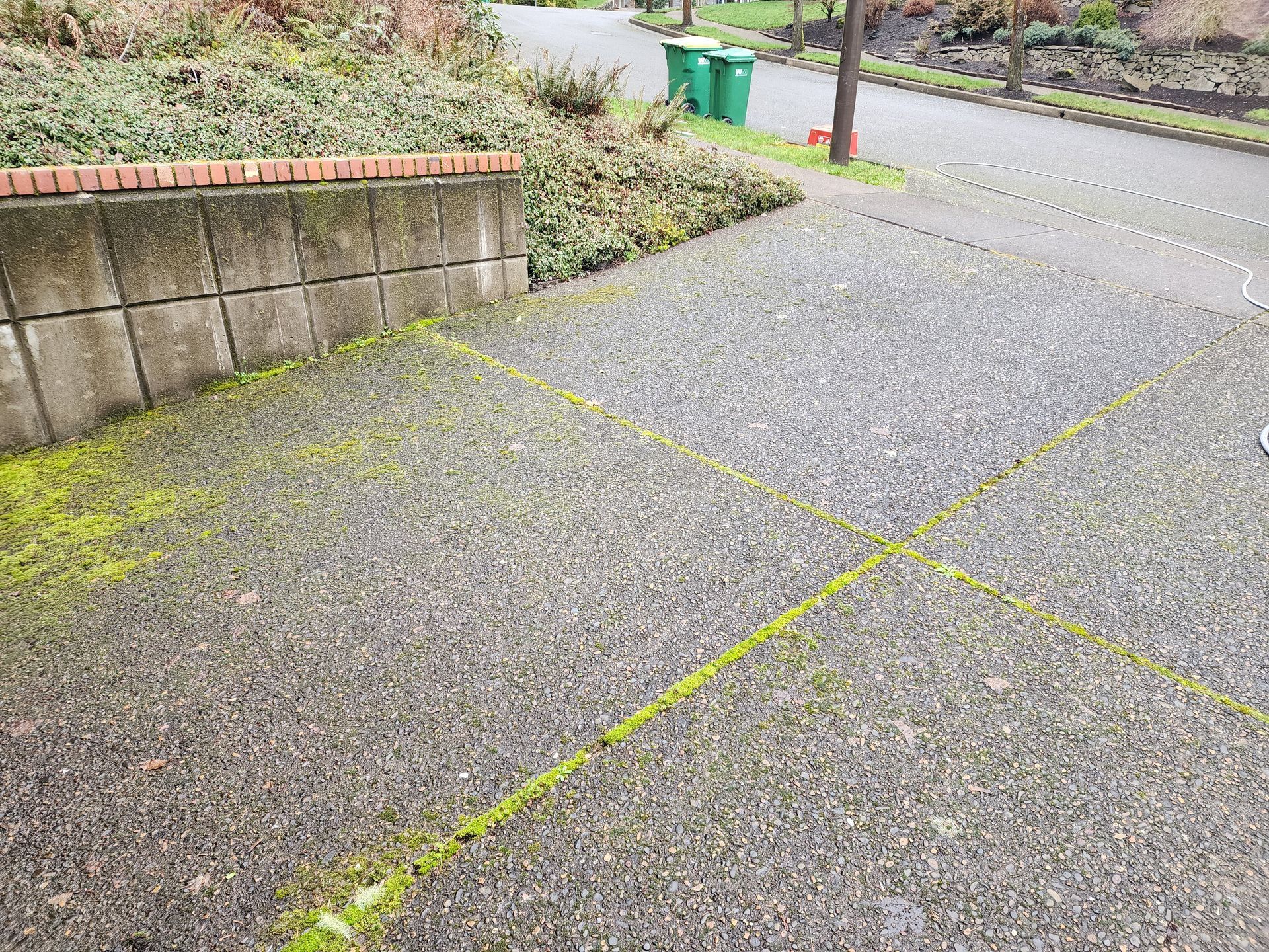 Hot water pressure washing removing mold from a home's exterior in Tigard Oregon