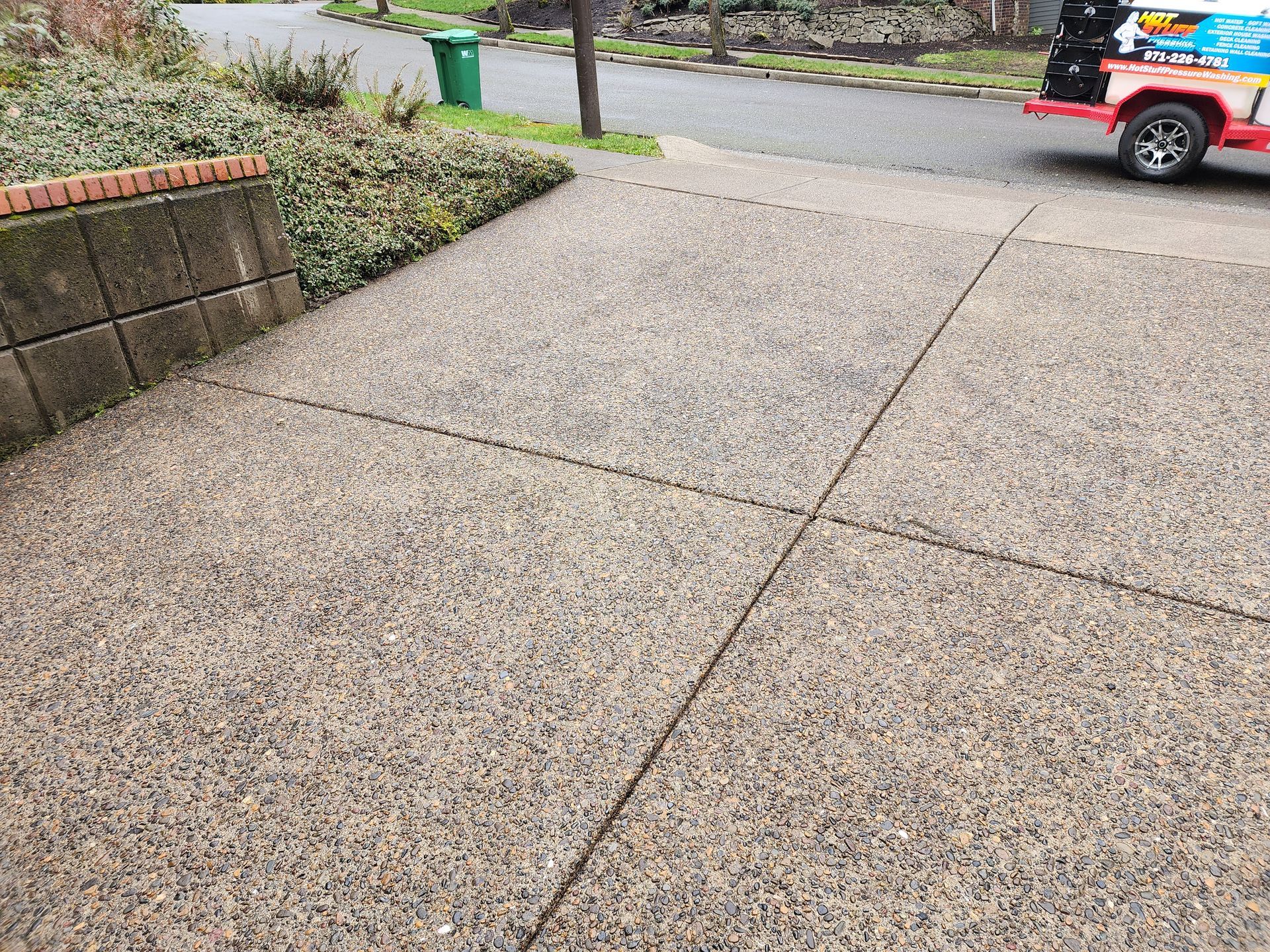 Hot water pressure washing removing mold from a home's exterior in Tigard Oregon