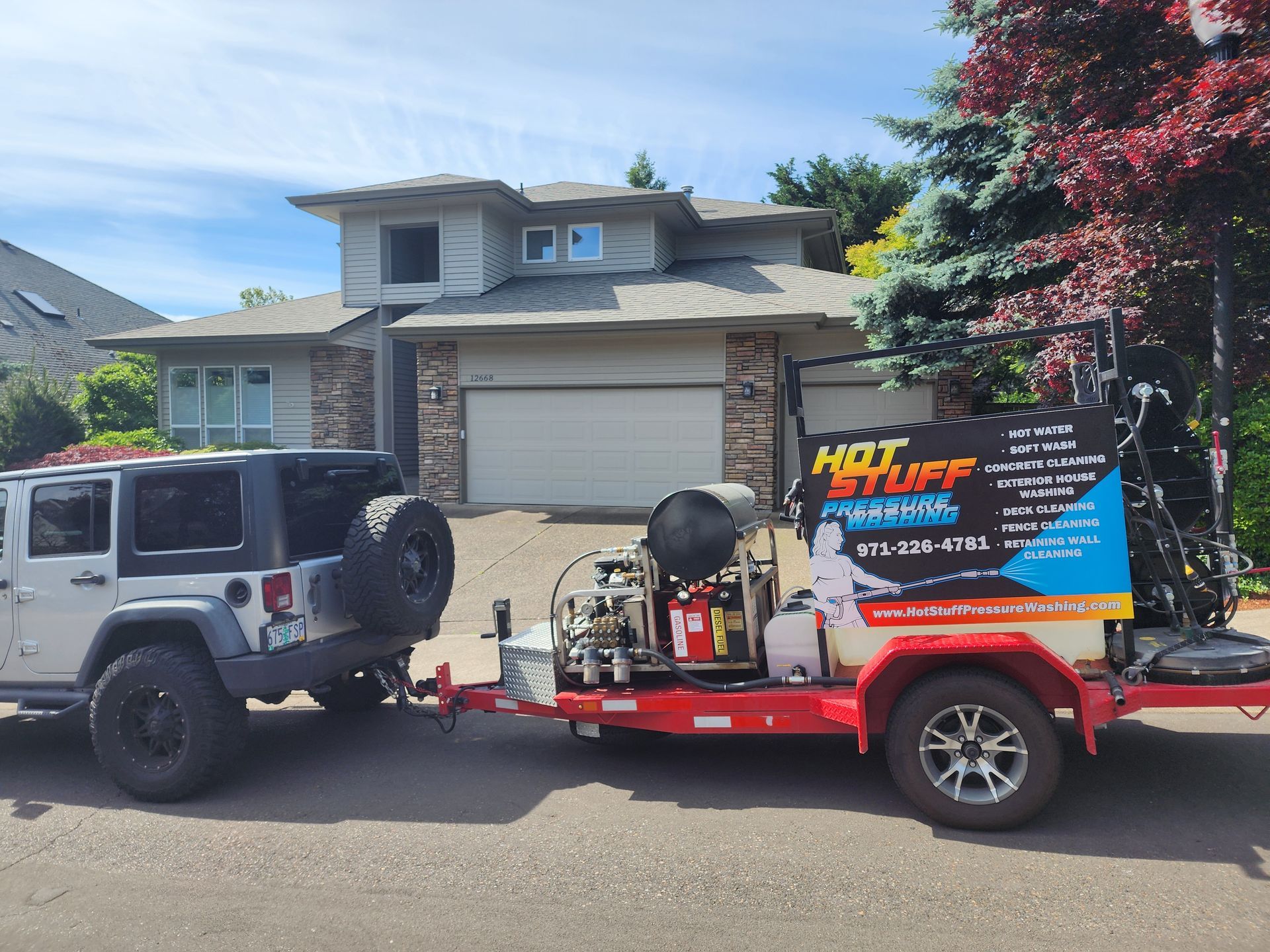 High-pressure hot water cleaning a concrete driveway, removing dirt and grime in Tigard Oregon