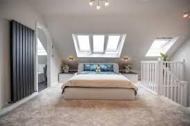 Best Suffolk loft conversion for luxury bedroom by Pro Build East Ltd with sky lights giving natural light & en suite bathroom