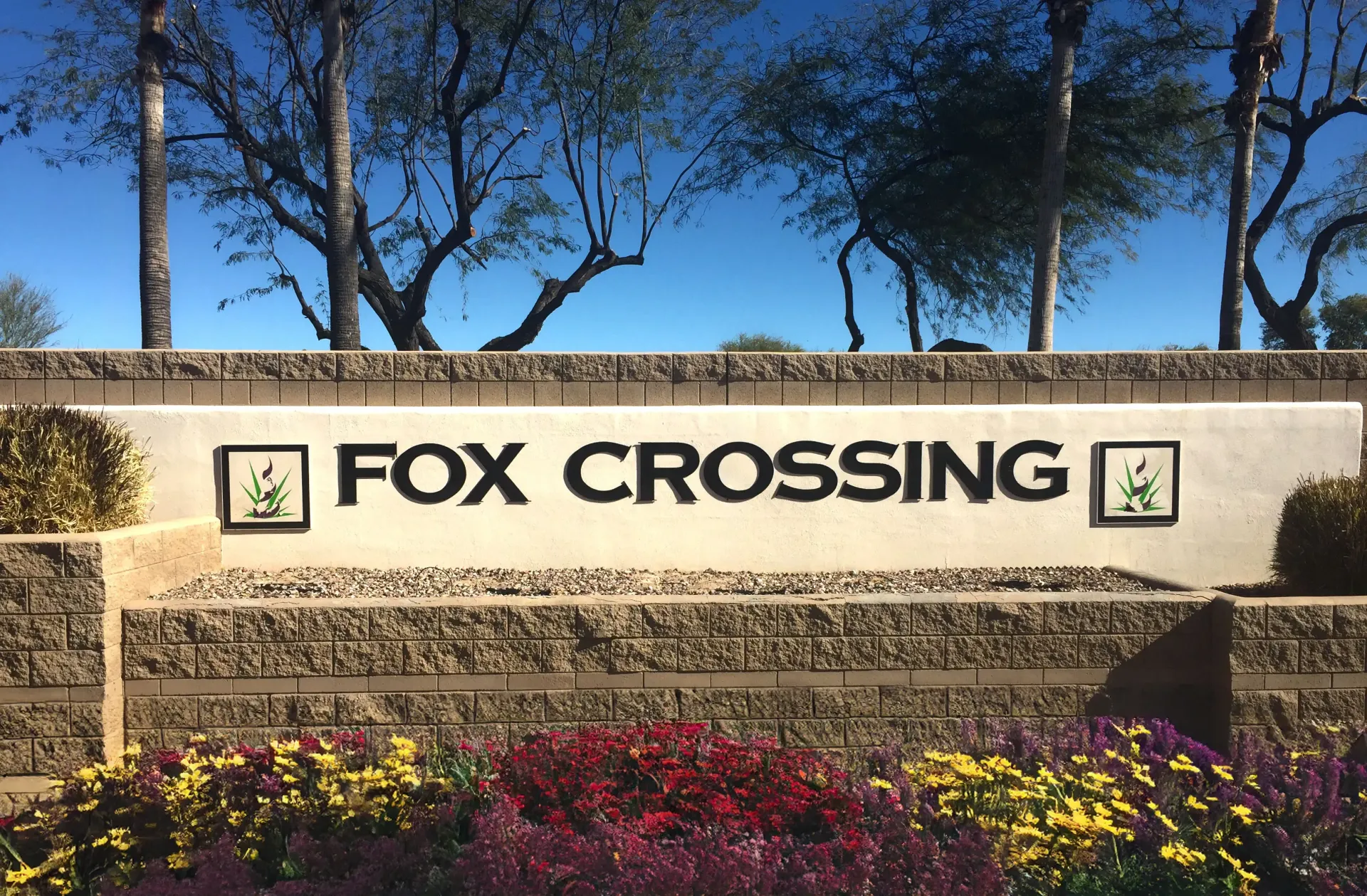 A sign that says fox crossing on it