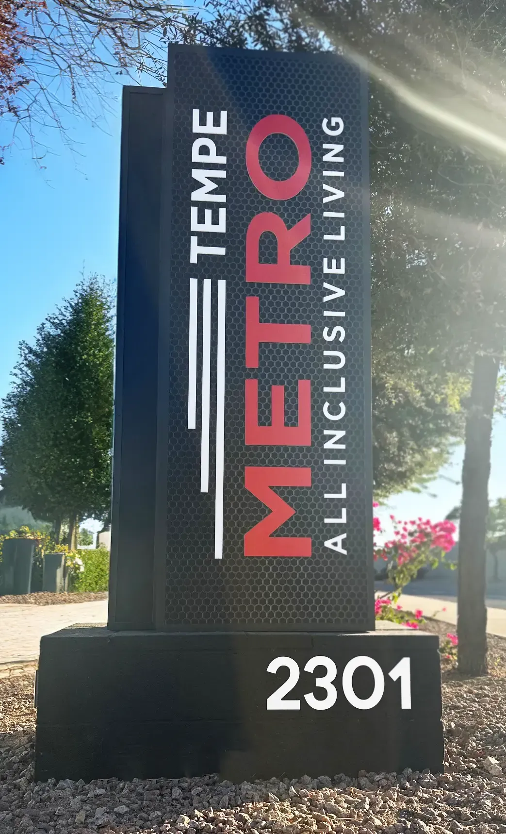 A sign for metro tempe all inclusive living