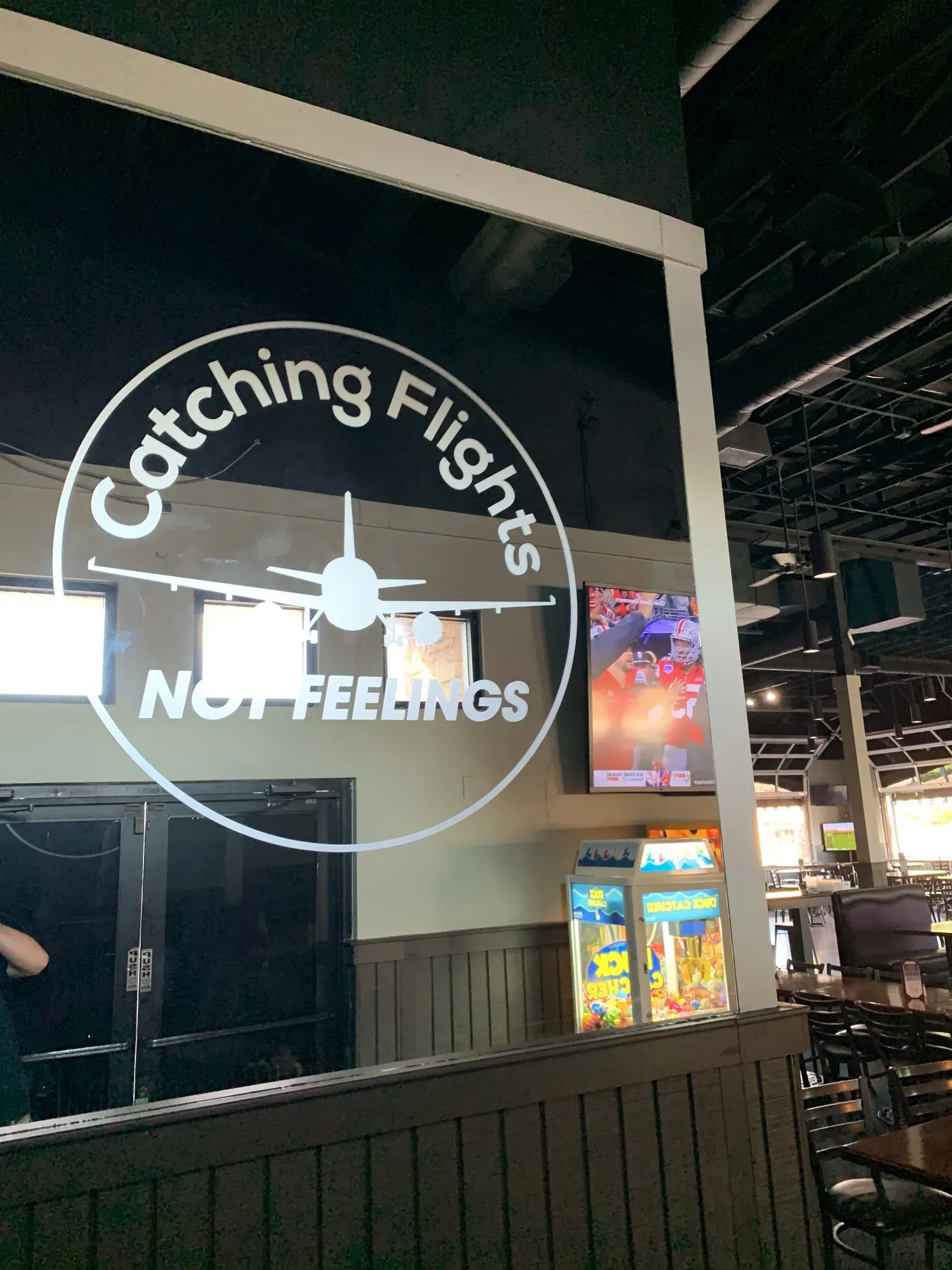 A restaurant with a sign that says catching flights not feelings