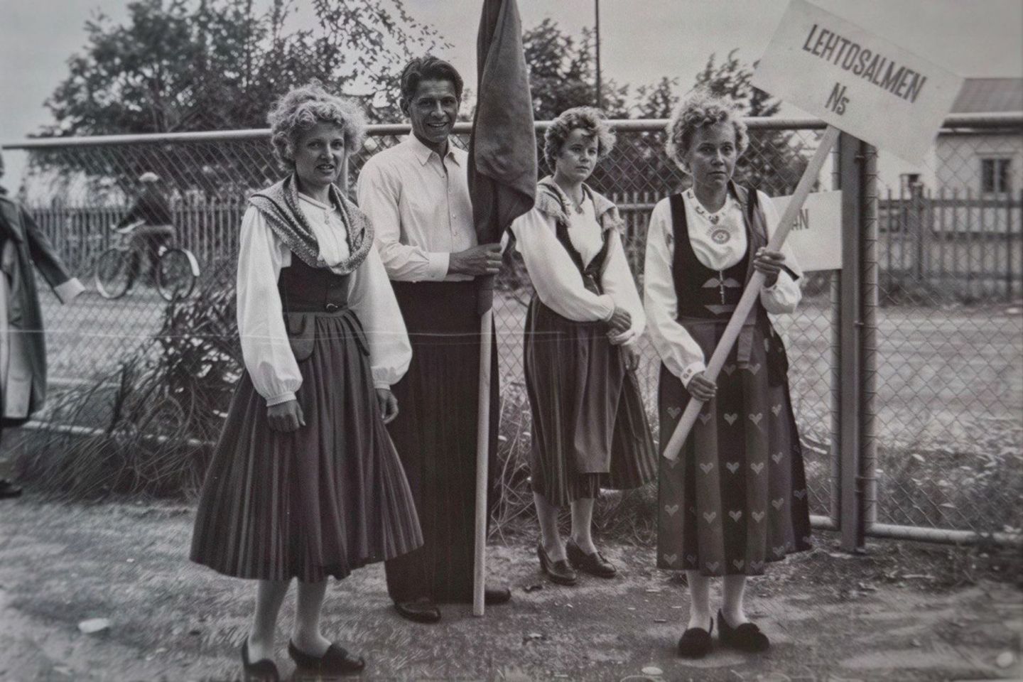Arctic GM family members wearing Finnish folk dress at a community gathering in Lapland