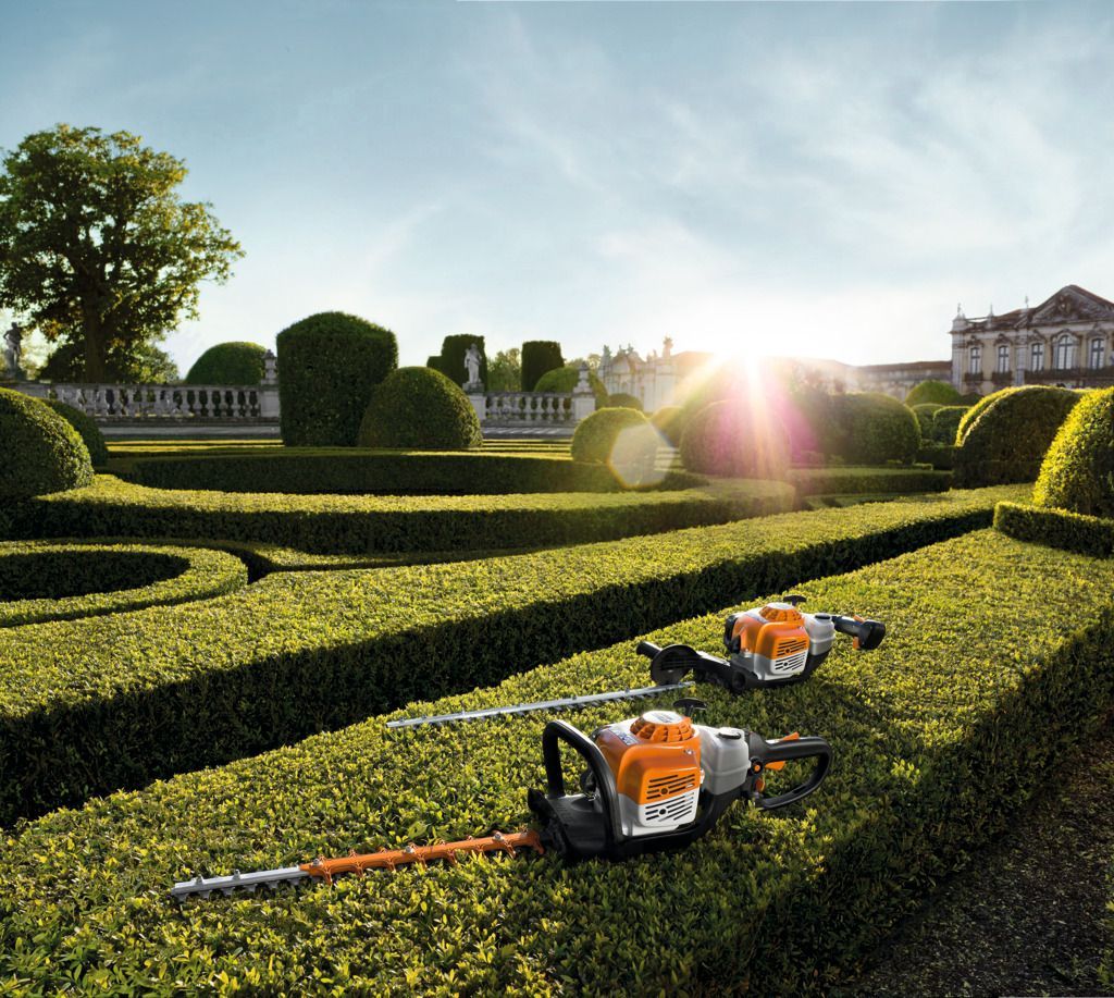 Two Stihl Hedge Trimmers Are Sitting in A Garden — Stihl Shop Grafton in Iluka, NSW