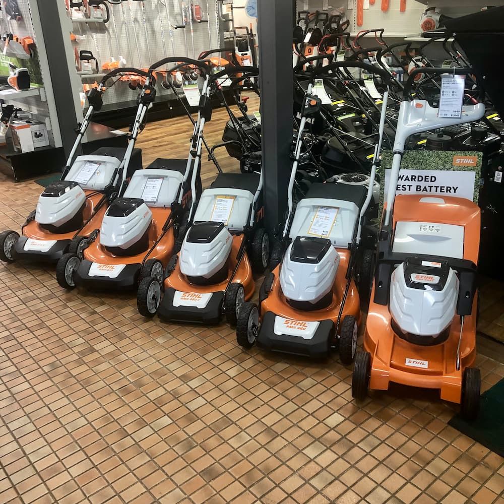 A Row of Lawn Mowers Are Lined up In a Store — Stihl Shop Grafton in Grafton, NSW